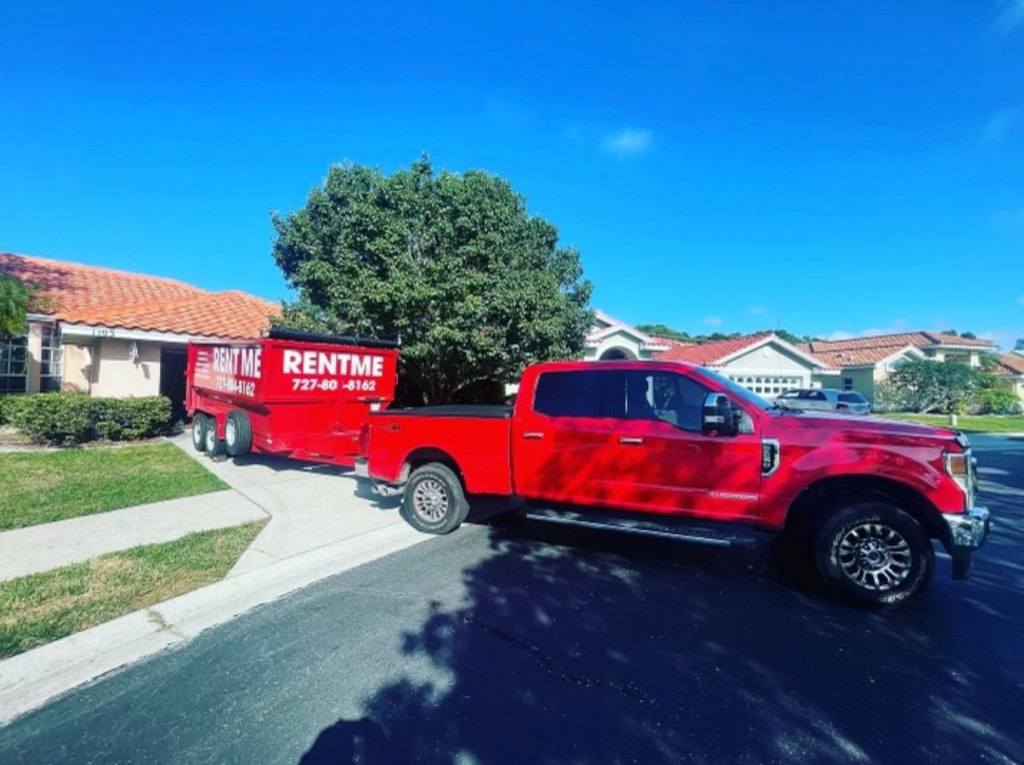 Big Red Dumpster Rental Sarasota being dropped off at a customer's house. 